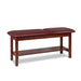a classic medical table with shelf,  burgundy upholstery and dark cherry base color