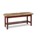 a classic medical table with shelf,  desert tan upholstery and dark cherry base color