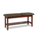 a classic medical table with shelf,  gunmetal upholstery and dark cherry base color