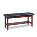 a classic medical table with shelf,  slate blue upholstery and dark cherry base color