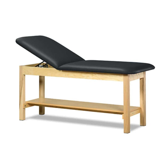 a classic medical table with shelf,  black upholstery and natural base color