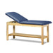 a classic medical table with shelf,  royal blue upholstery and natural base color