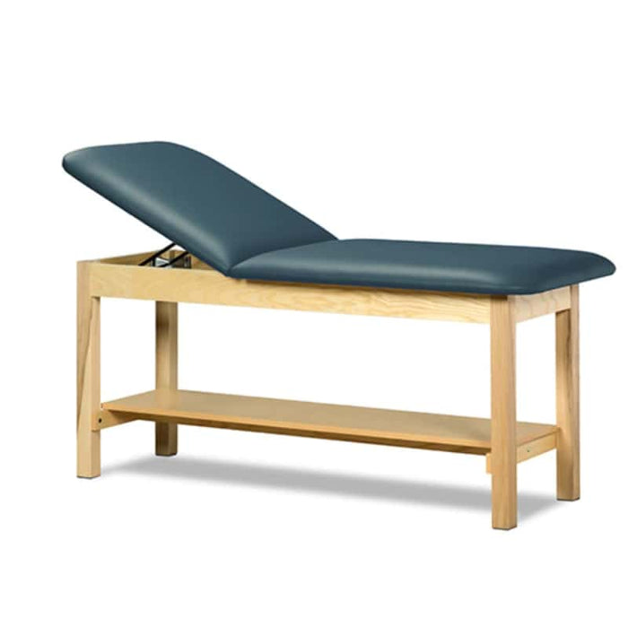 a classic medical table with shelf,  slate blue upholstery and natural base color