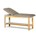 a classic medical table with shelf,  warm gray upholstery and natural base color