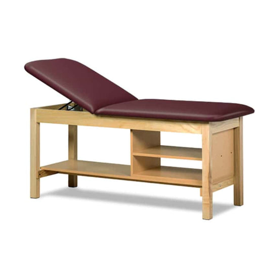 a classic medical table with shelving,  burgundy upholstery and natural base color