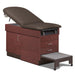 A medical examination table with drawers and patient step stool, gunmetal upholstery and dark cherry base color