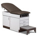 A medical examination table with drawers and patient step stool, gunmetal upholstery and gray base color