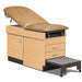 A medical examination table with drawers and patient step stool, desert tan upholstery and maple base color