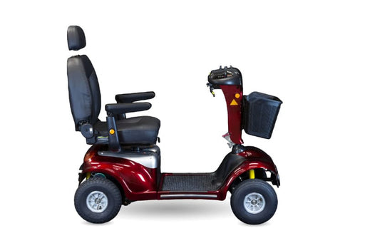 side view of a black and red mobility scooter